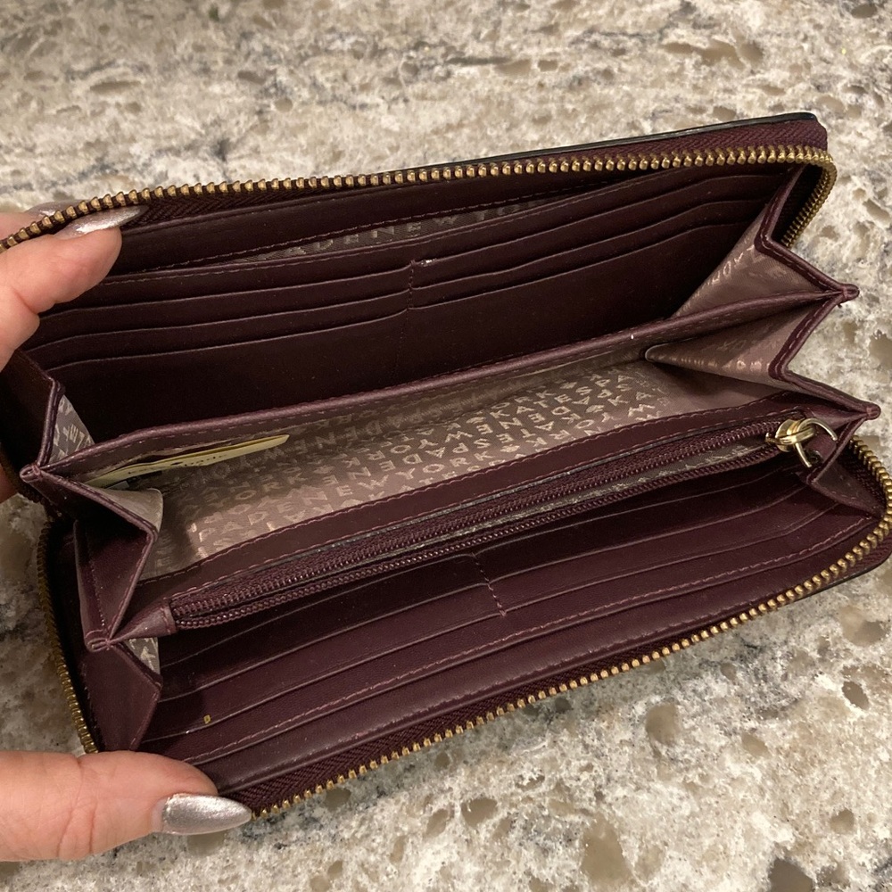 Kate Spade top zip maroon wallet
EXCELLENT CONDITION I have matching crossbody - Picture 5 of 7